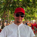 man smiling with cap